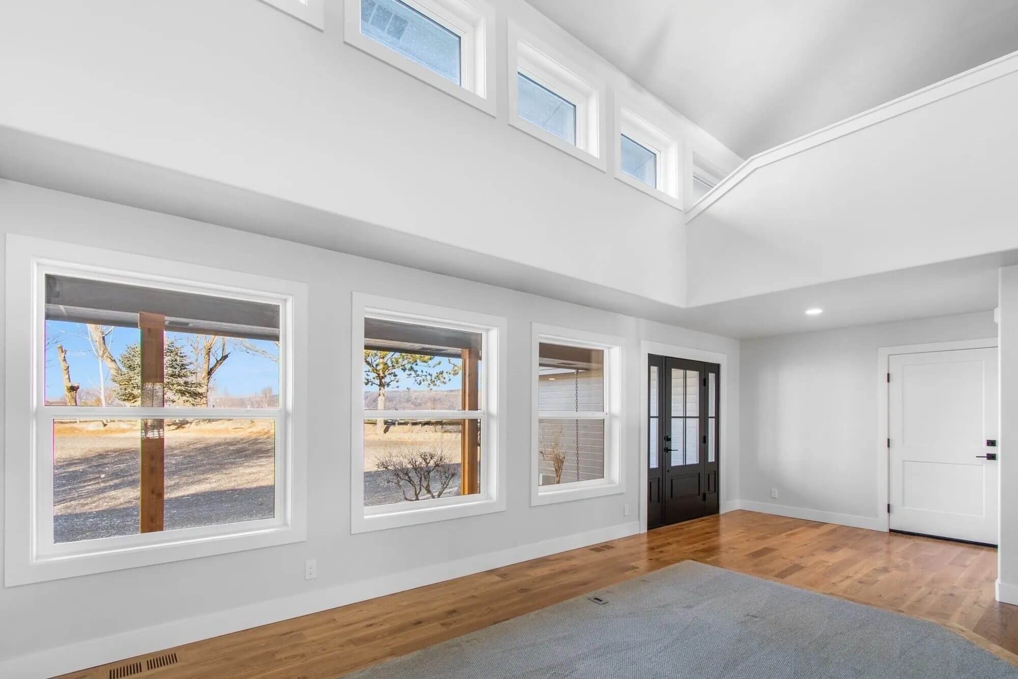 Bright living room with large windows.