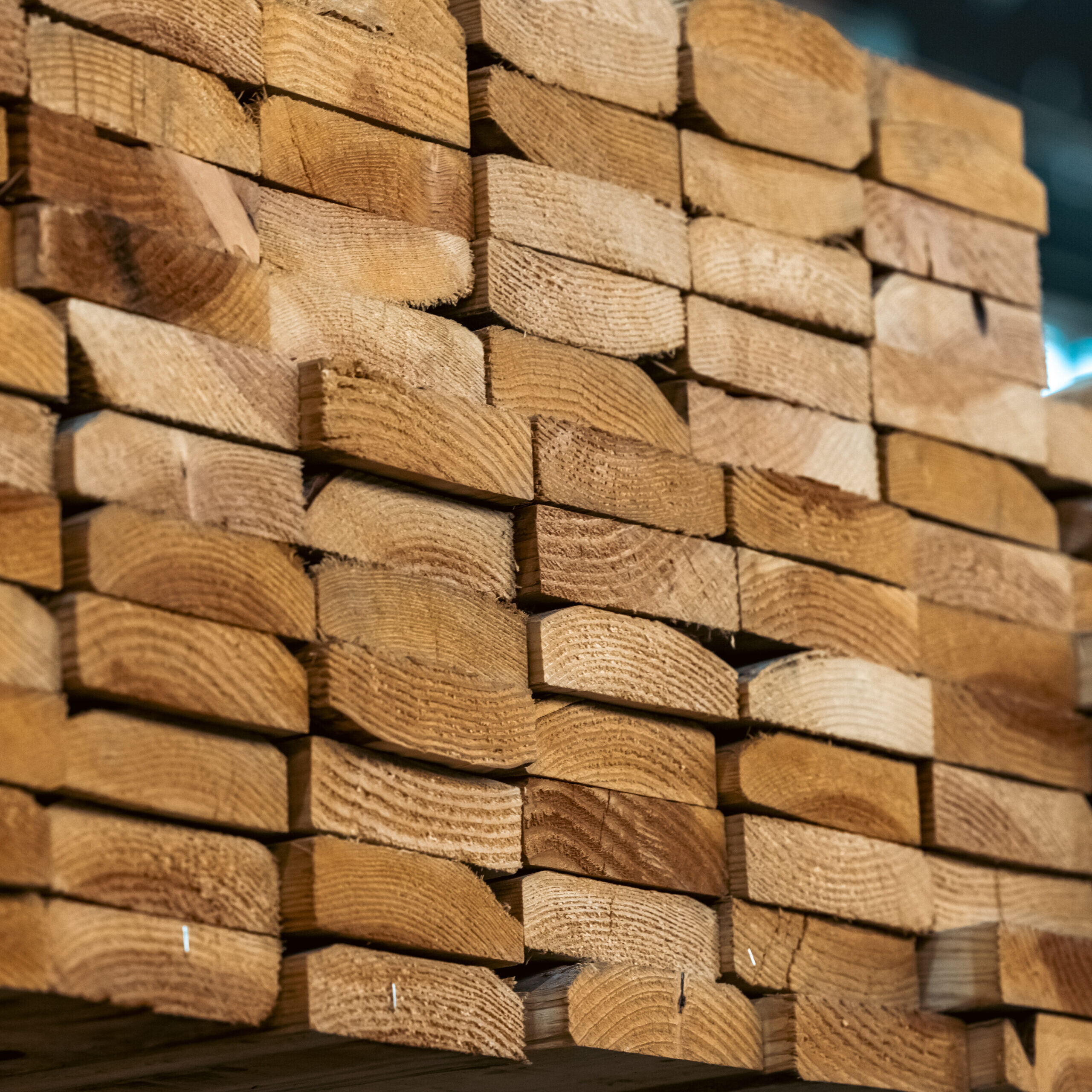 Stacked wooden planks with visible grain and texture.